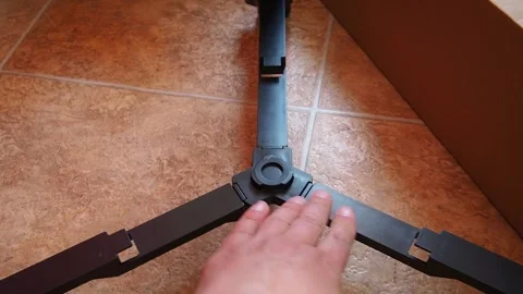 Assembling a tripod or tripod for a refractor telescope, installing a stage for Stock Footage 270437230