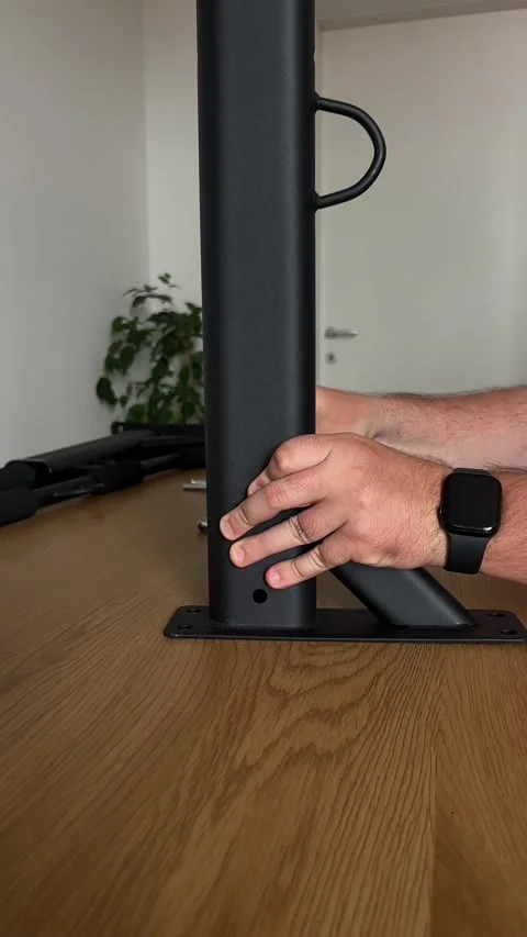 Assembling Wall-Mounted Pull-Up Bar on Table Stock Footage 311021573