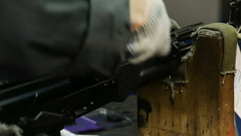 Assembling weapons in the workplace. Assaul rifles. Close up view Stock Footage 92144083