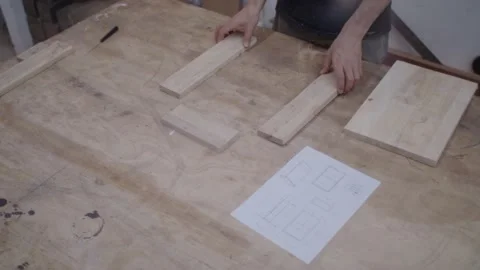 Assembling a wooden box from blueprint Stock-Footage 151127206