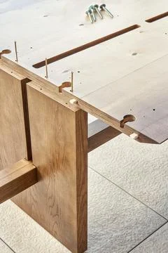 Assembling of wooden dining table with worktop connectors 写真素材