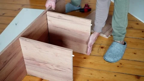 Assembling Wooden Drawer Components at Home for DIY enthusiasts and woodworking Stock Footage 308663938