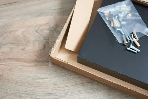 Assembling a wooden shelf at home. Stock Photos