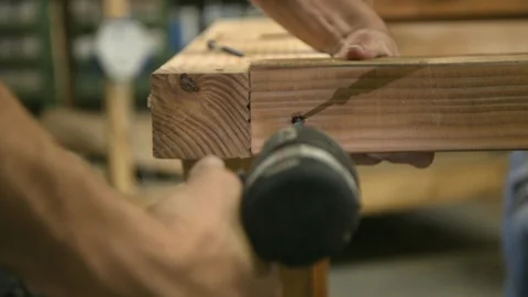 Assembling a wooden table Stock Footage 87128416
