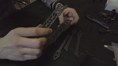 Assembly of carbon frame for FPV quadcopter, 5 inches Stock Footage 168341081