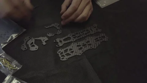 Assembly of carbon frame for FPV quadcopter, 5 inches Stock Footage 168341249