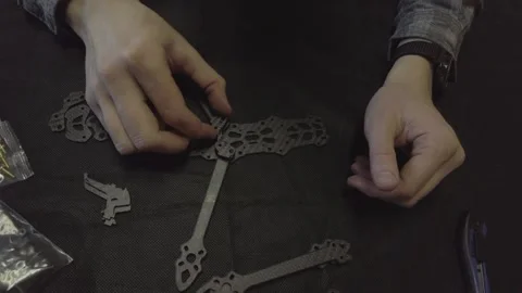 Assembly of carbon frame for FPV quadcopter, 5 inches Stock Footage 168341640