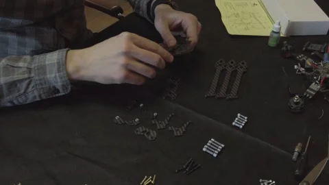 Assembly of carbon frame for FPV quadcopter, 5 inches Stock Footage 168342146