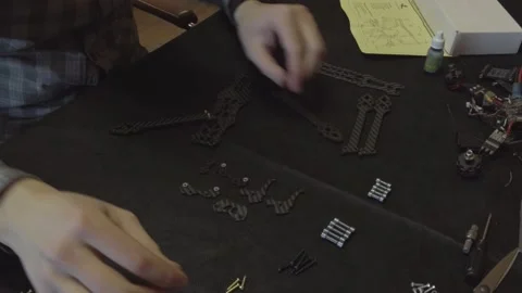 Assembly of carbon frame for FPV quadcopter, 5 inches Stock Footage 168342264
