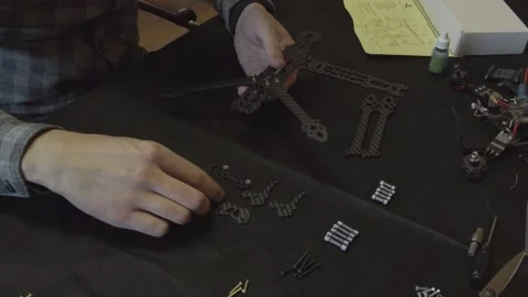 Assembly of carbon frame for FPV quadcopter, 5 inches Stock Footage 168342315