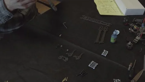 Assembly of carbon frame for FPV quadcopter, 5 inches Stock Footage 168342353