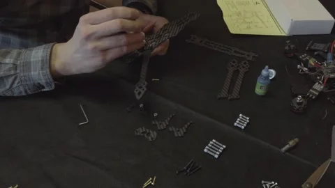 Assembly of carbon frame for FPV quadcopter, 5 inches Stock Footage 168342498