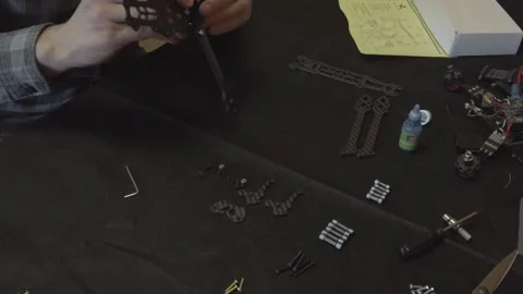 Assembly of carbon frame for FPV quadcopter, 5 inches Stock Footage 168342582