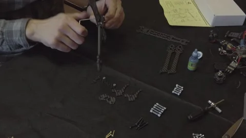 Assembly of carbon frame for FPV quadcopter, 5 inches Stock Footage 168342620