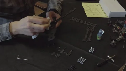 Assembly of carbon frame for FPV quadcopter, 5 inches Stock Footage 168342771