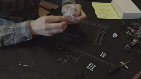 Assembly of carbon frame for FPV quadcopter, 5 inches Stock Footage 168343002