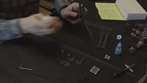 Assembly of carbon frame for FPV quadcopter, 5 inches Stock Footage 168343283