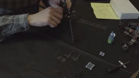Assembly of carbon frame for FPV quadcopter, 5 inches Stock Footage 168343923