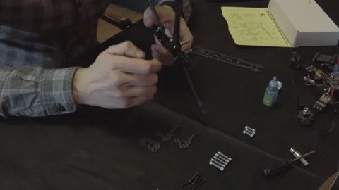 Assembly of carbon frame for FPV quadcopter, 5 inches Stock Footage 168344045