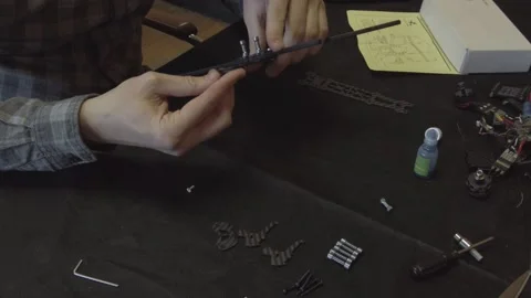 Assembly of carbon frame for FPV quadcopter, 5 inches Stock Footage 168344864
