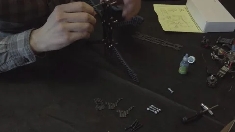 Assembly of carbon frame for FPV quadcopter, 5 inches Stock Footage 168345039