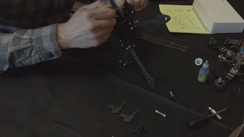 Assembly of carbon frame for FPV quadcopter, 5 inches Stock Footage 168345688