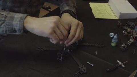 Assembly of carbon frame for FPV quadcopter, 5 inches Stock Footage 168347698