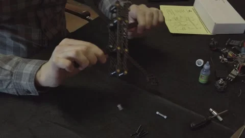 Assembly of carbon frame for FPV quadcopter, 5 inches Stock Footage 168348162