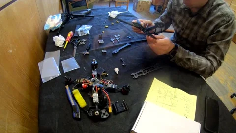 Assembly of carbon frame for FPV quadcopter, 5 inches Stock Footage 168348342