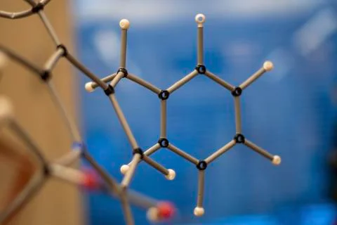 Assembly of comples organic molecule structure with blur background for under Stock Photos