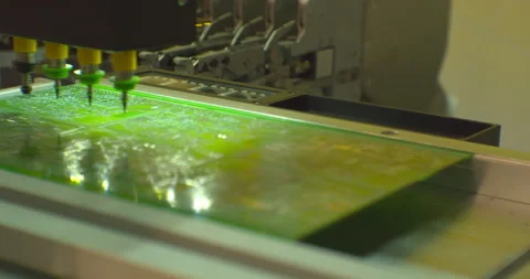 Assembly of a complex electronic board by an industrial robot.Close-up Stock Footage 152775685
