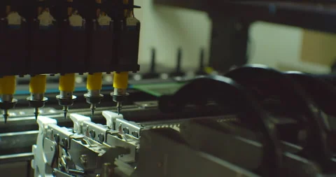 Assembly of a complex electronic board by an industrial robot.Close-up Stock Footage 152779432