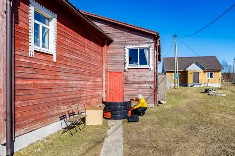 Assembly of compost bin, pieces will snap together and lock securely, woman.. Stock Photos