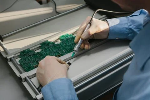 The assembly of computer units. Technological process. Stock Photos