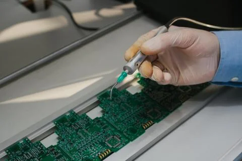 The assembly of computer units. Technological process. Stock Photos