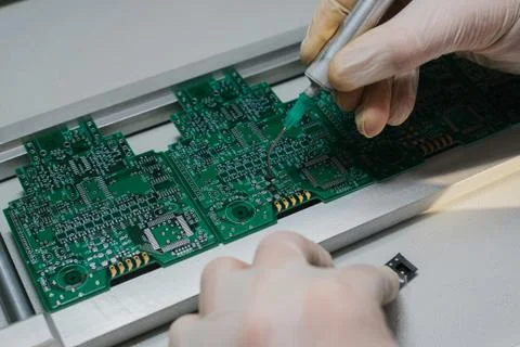 The assembly of computer units. Technological process. Stock Photos
