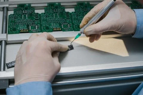 The assembly of computer units. Technological process. Stock Photos