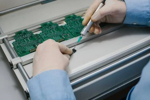 The assembly of computer units. Technological process. Stock Photos