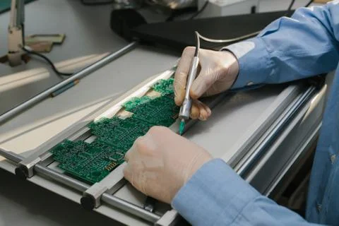 The assembly of computer units. Technological process. Stock Photos