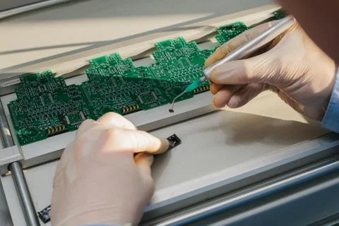 The assembly of computer units. Technological process. Stock Photos