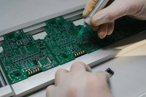 The assembly of computer units. Technological process. Stock Photos