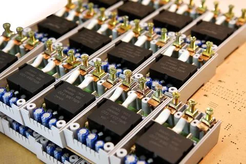 Assembly of electronic components for voltage relays. Manual assembly of elec Stock Photos