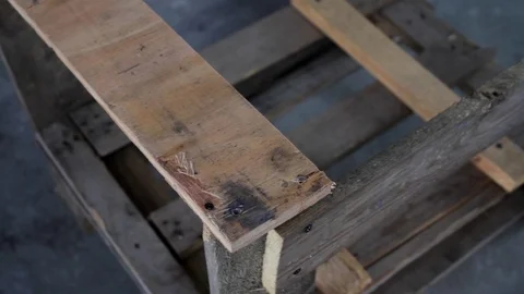 Assembly of the frame for sending fragile cargo, tightening screws Stock Footage 112351264