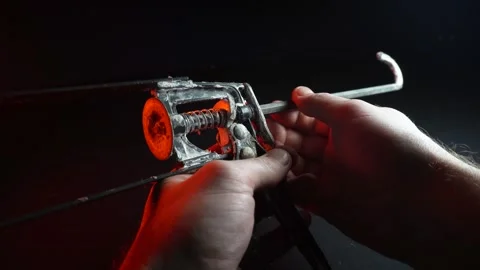 Assembly gun for sealants for construction work in red light Stock Footage 302340447