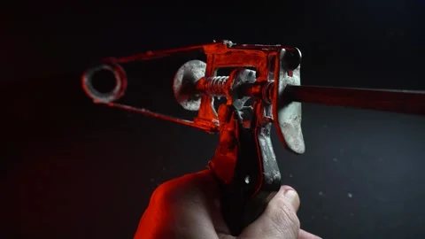 Assembly gun for sealants for construction work in red light Видео 302340481