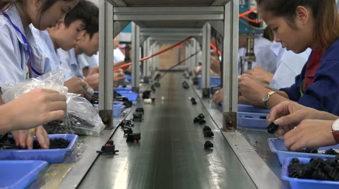 Assembly line factory workers in China Stock Footage