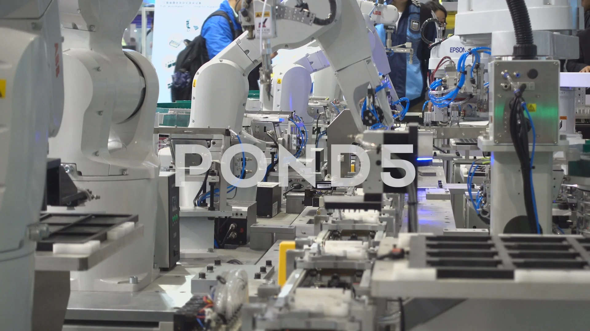 Assembly line robots on display at a Stock Video Pond5