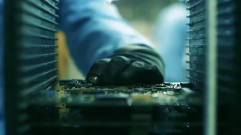 Assembly Line Worker placing a PCB Board into Rack at a Computer Factory. 4K. Stock Footage 155083434