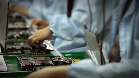 Assembly Line Workers manufacturing Laptop Computers. Timelapse. Stock Footage