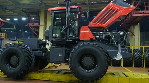 Assembly line workers on tractor factory.  Workmen working on a factory. Stock Footage 110735791